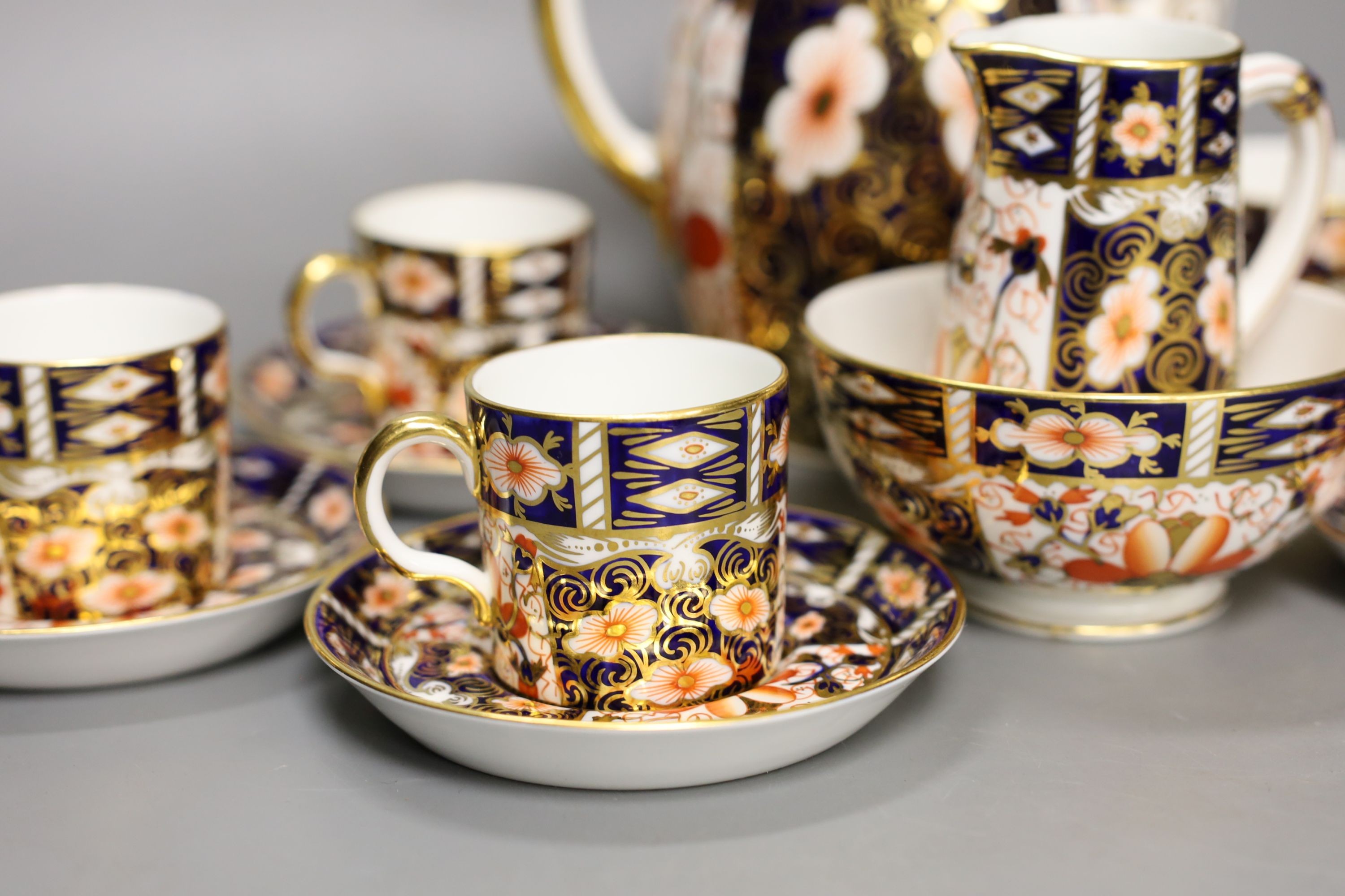 A Royal Crown Derby Imari pattern 2451 coffee set, comprising coffee pot, bowl jug and six cups and saucers.